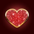 a red shiny heart in a gold frame